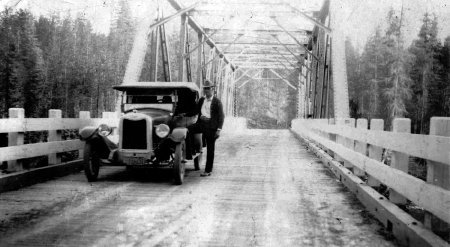 2011.21.36 George Bear with his Chevrolet on Dickensheet Bridge