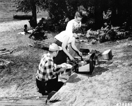 2011.21.6 Group Picnicking and Cooking on a Gas Stove